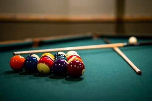 Closeup Of Billiard Balls And Sticks On The  Table
